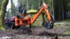 MCCormick Traktor mit Digger Heckbagger